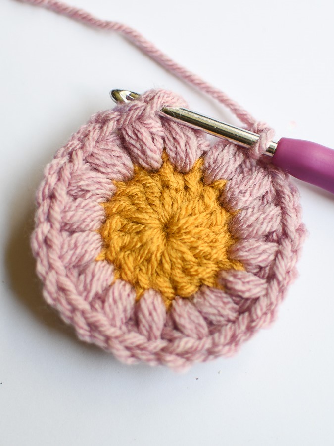 Insert the crochet hook through the first chain 2 space made to slip stitch then fasten off  