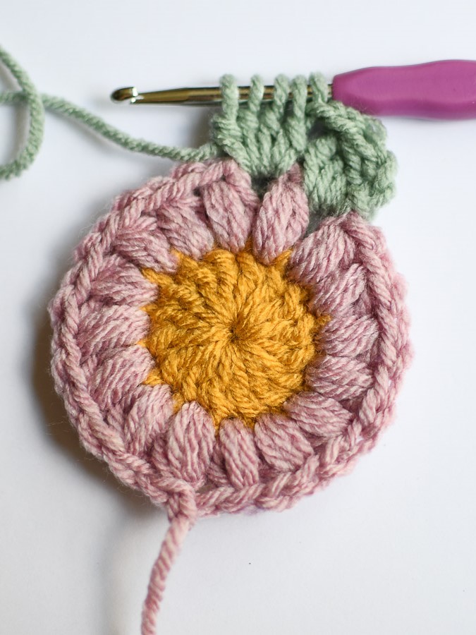 Create a full cluster stitch in the next space and each space around