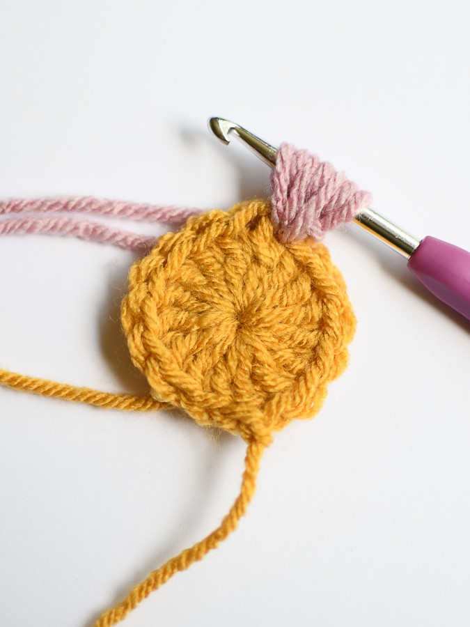 Creating a puff stitch with seven loops on the hook