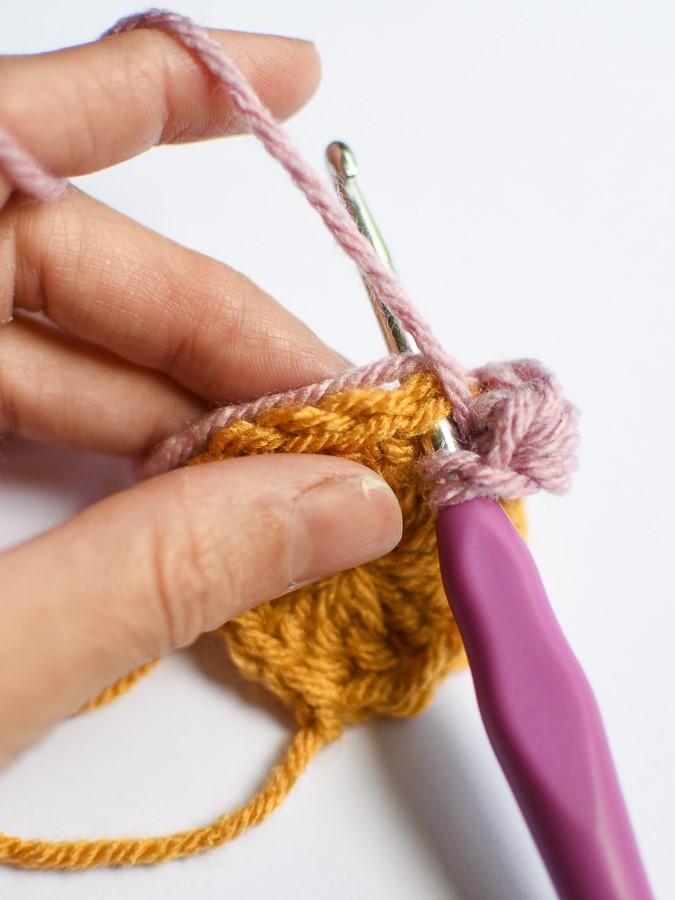 How to crochet over yarn tails to weave them in as you go