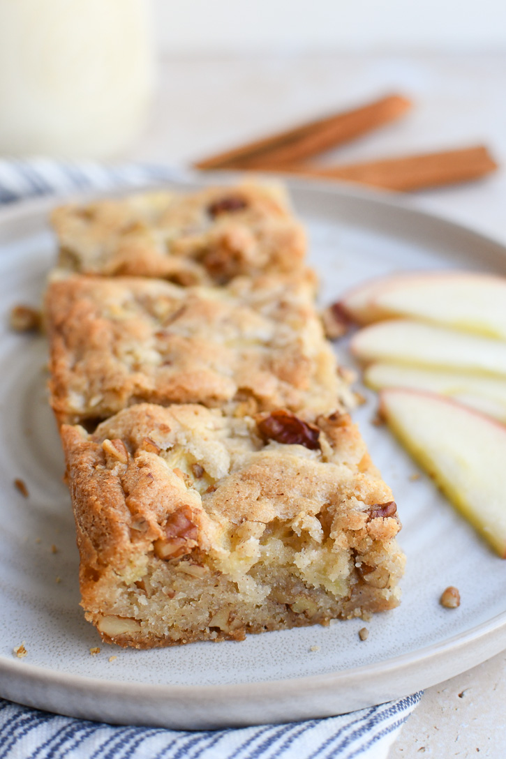 A plate of apple brownies showing the inside texture