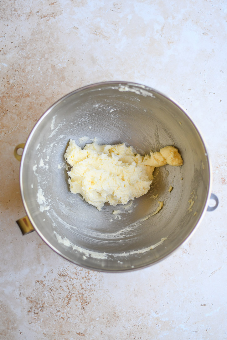 A bowl of creamed butter, sugar and egg.