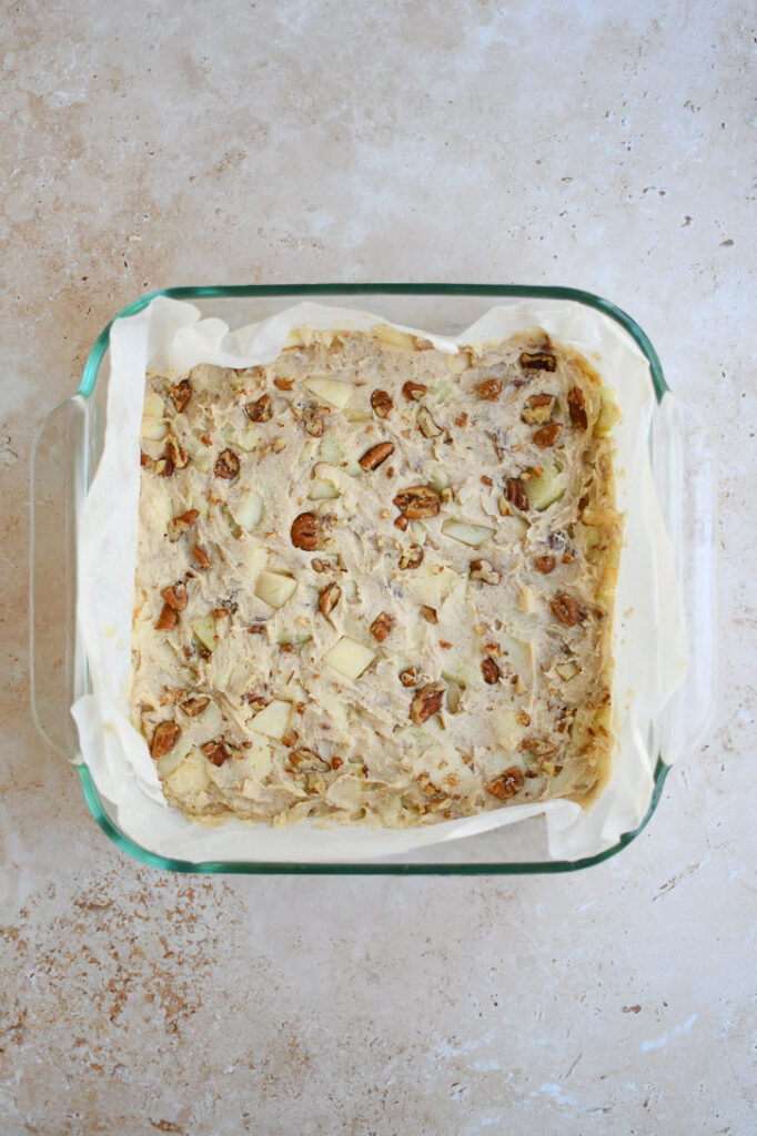 An 8 x 8 dish with the brownie batter before baking