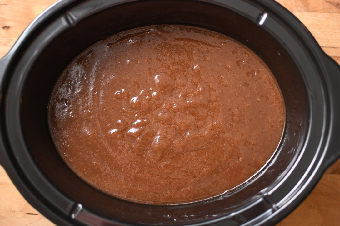 A crockpot with blended pear butter before cooking to final texture.