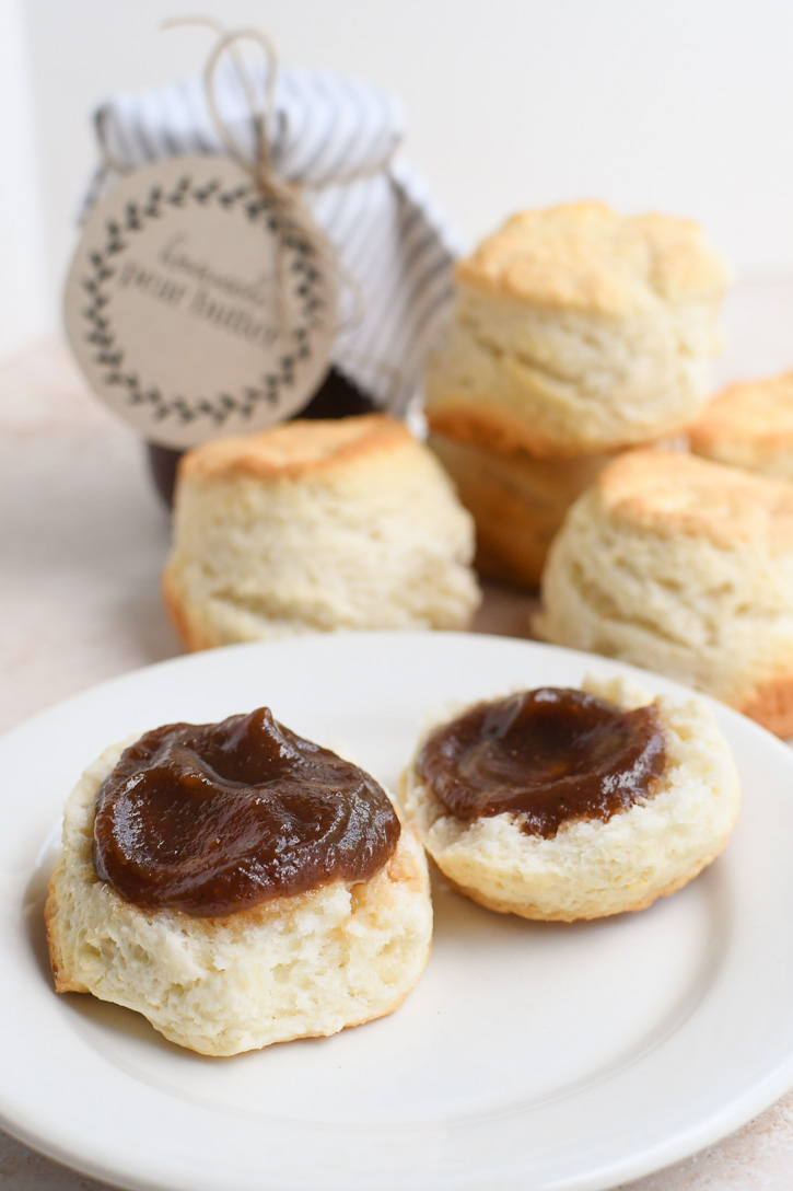 A plate of biscuits loaded with pear butter