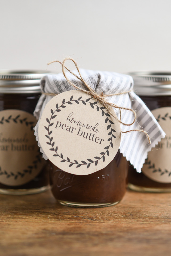 A jar of Pear Butter with a decorative label attached