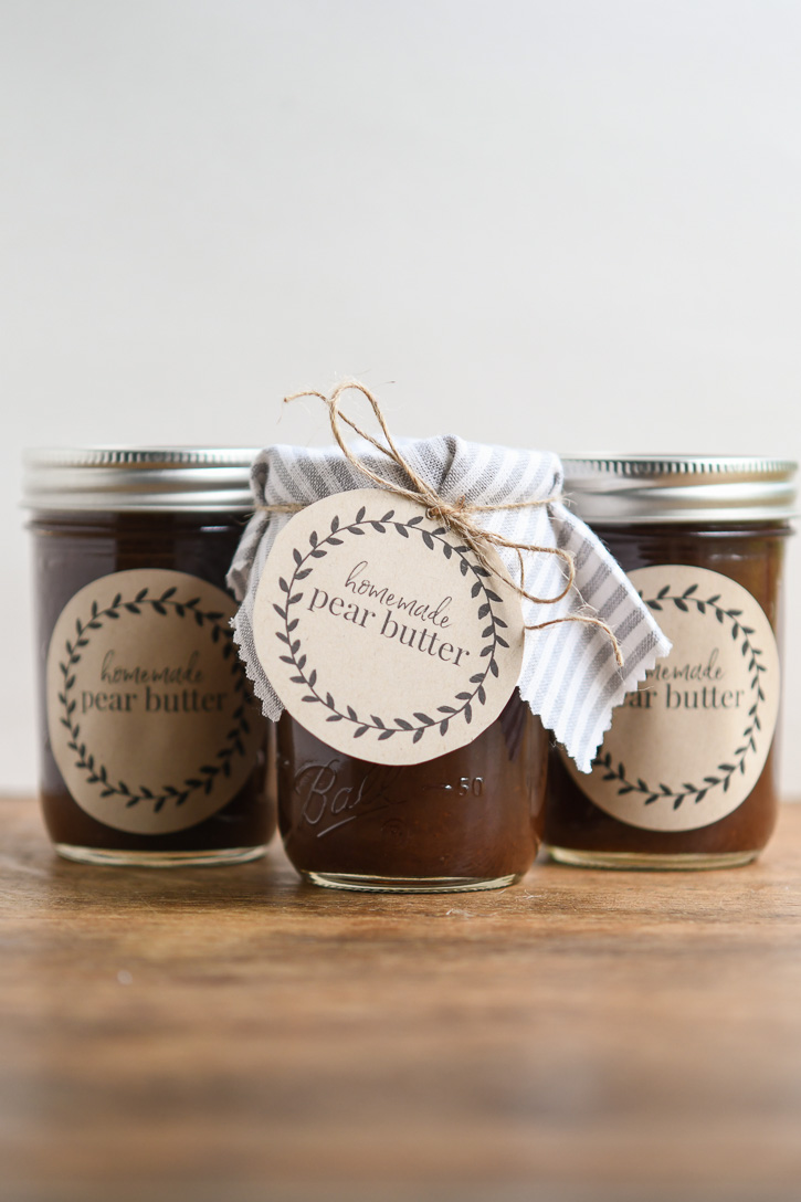 Three jars of pear butter with homemade labels attached