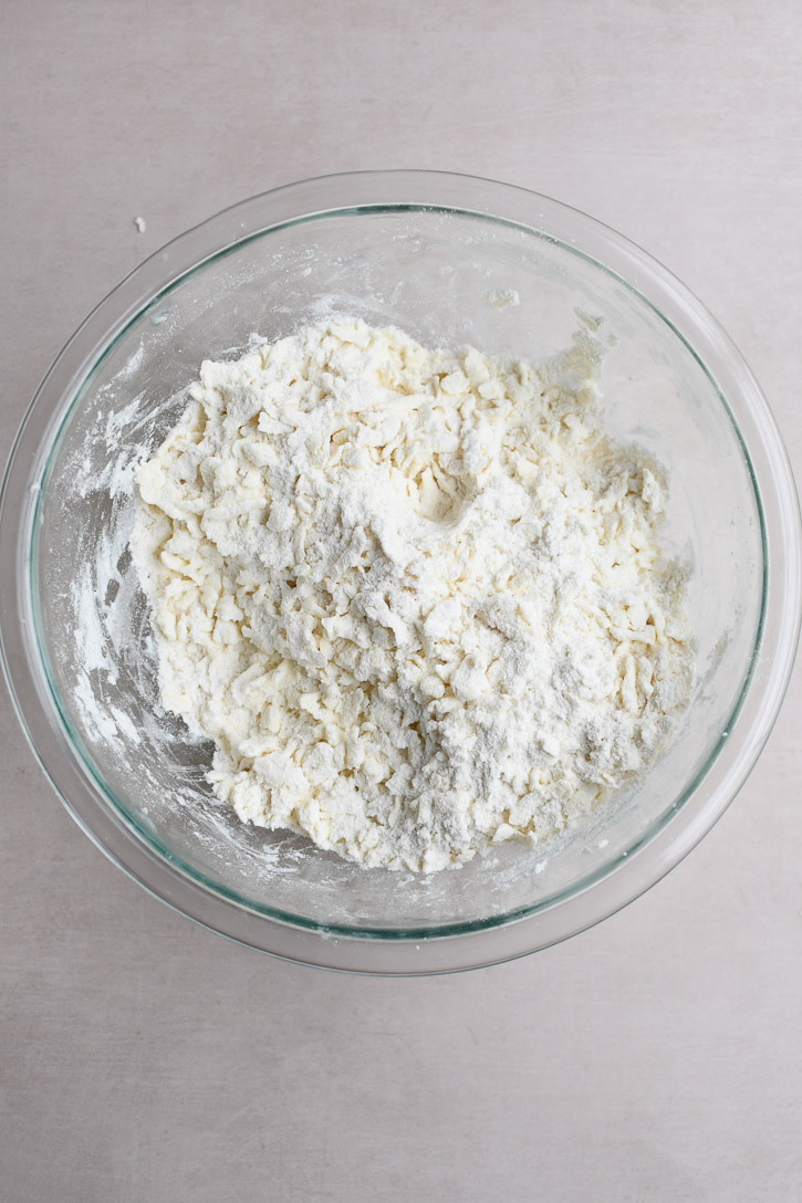 Grated butter coated in the flour and sugar mixture 