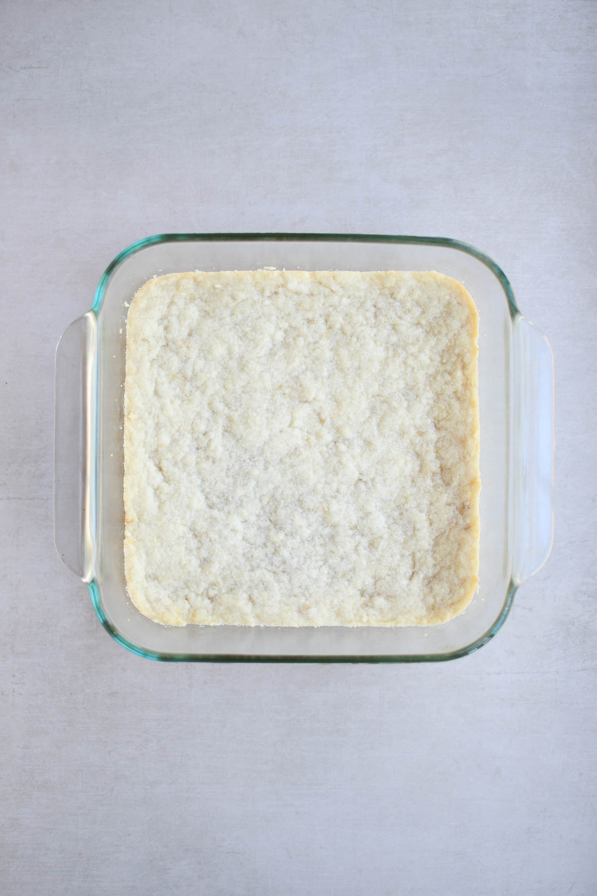 The baked shortbread crust before adding the filling 