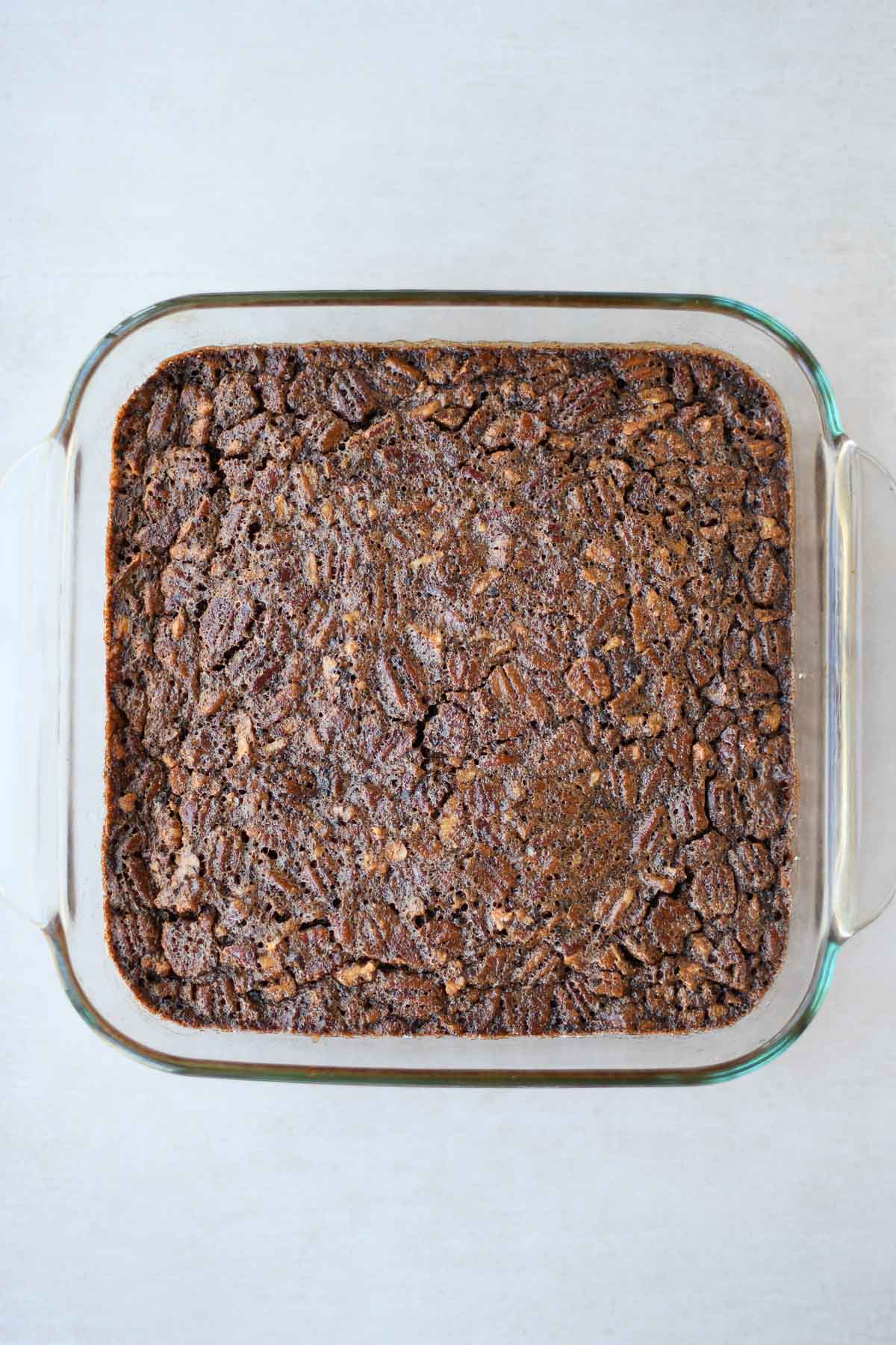 Freshly baked chocolate pecan pie bars, cooling before cutting