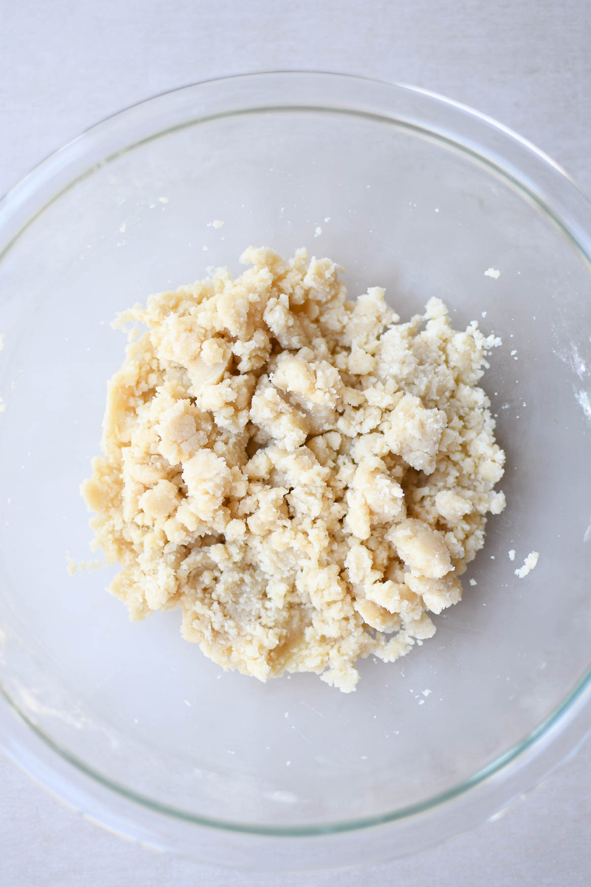 Shortbread crust ingredients in a mixing bowl after mixing