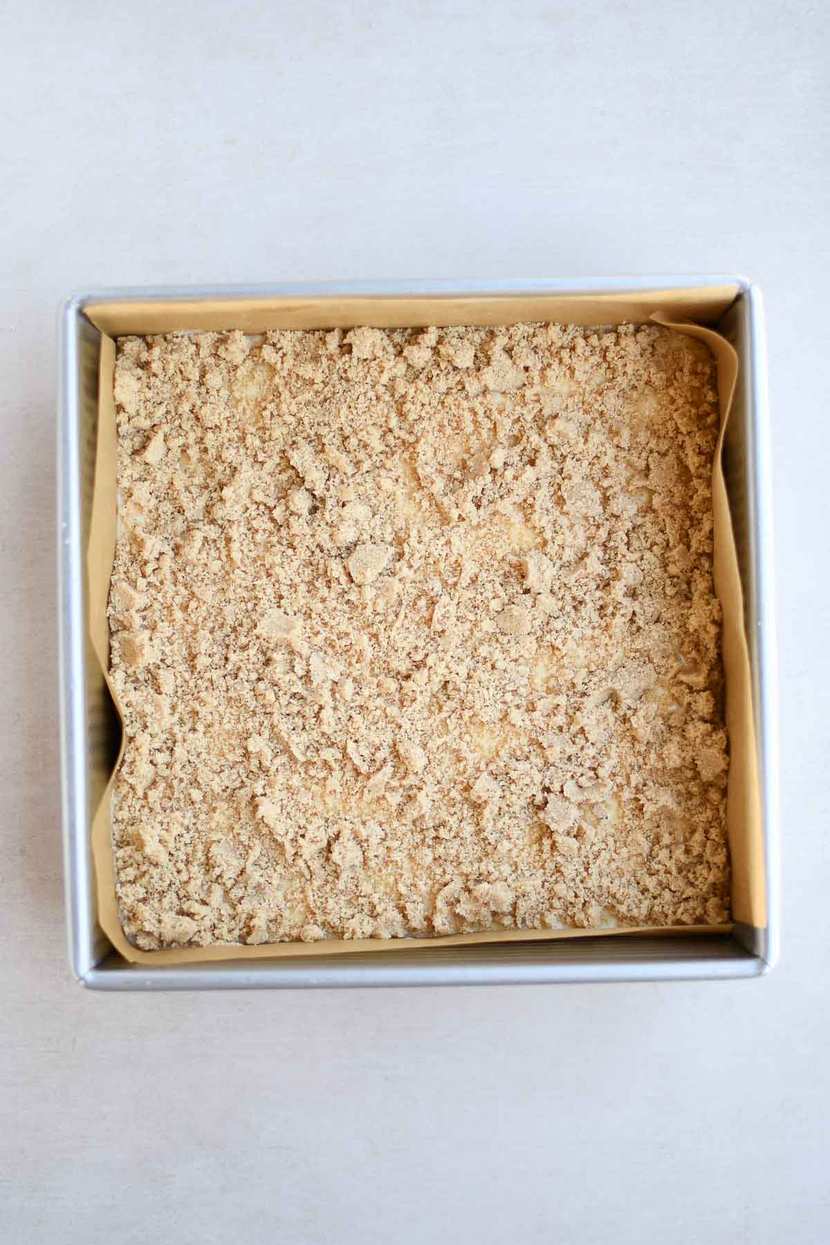 A prepared cheesecake bar before baking 