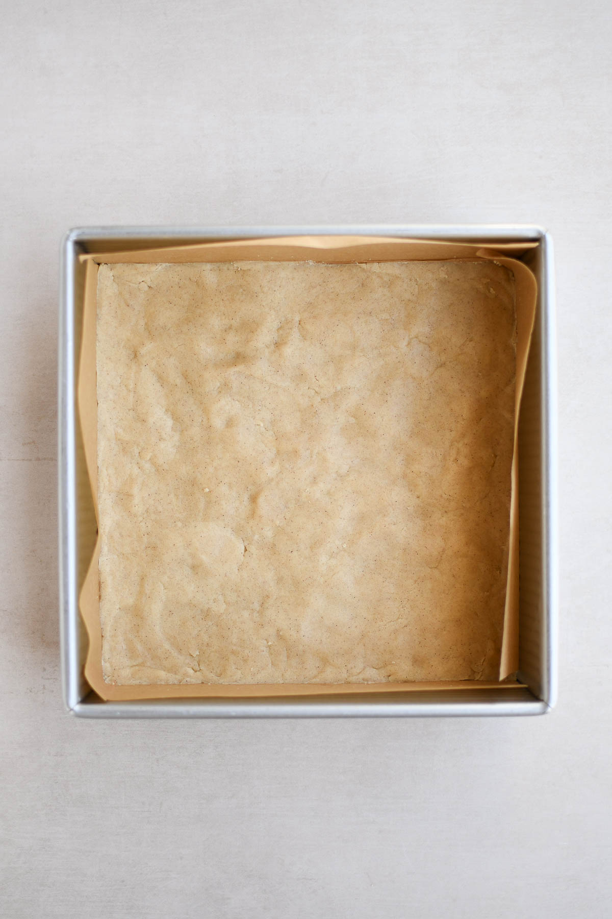 Shortbread dough pressed into a pan