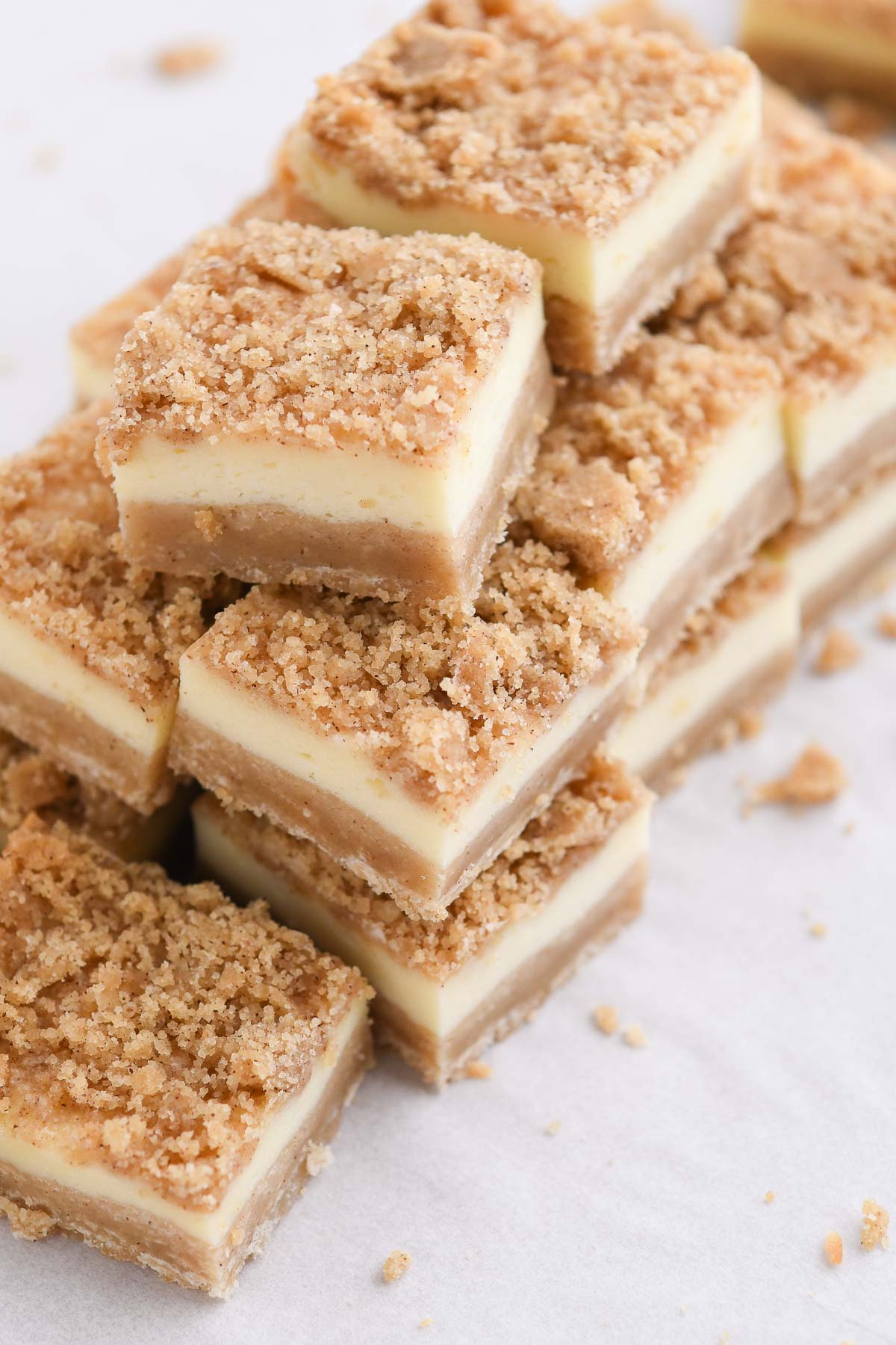 A stack of cheesecake bars close up to show texture and layers 